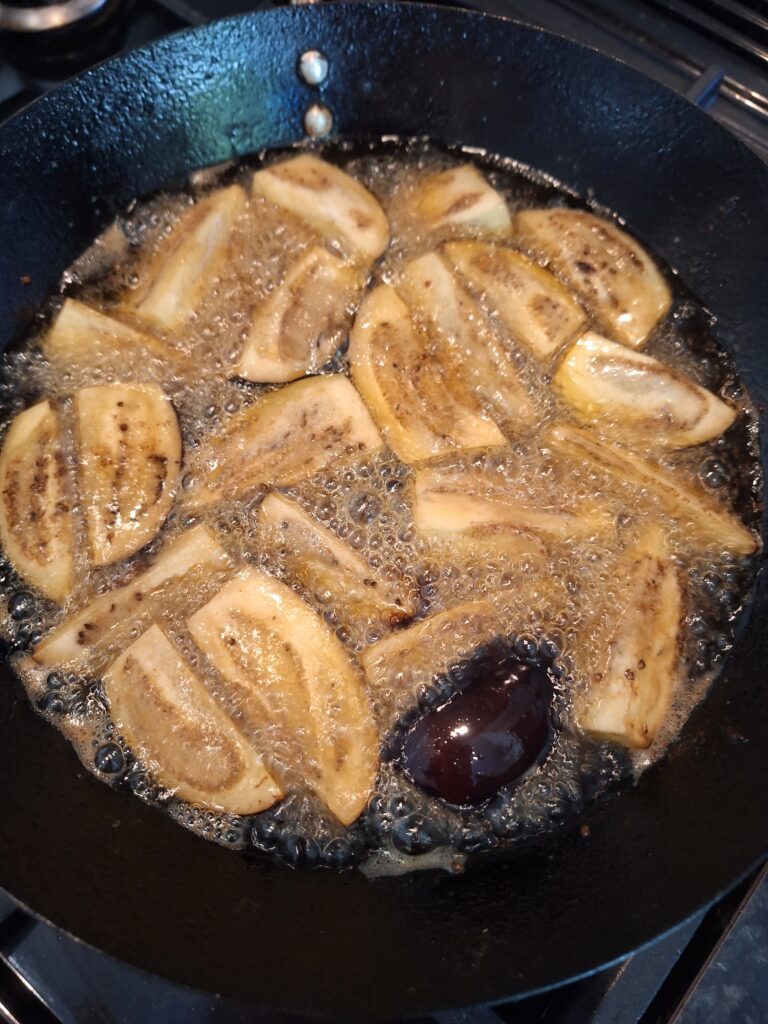 Frying aubergines