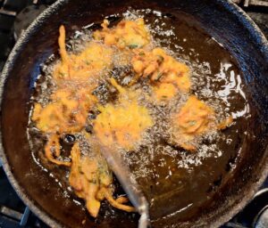 Deep frying the pakora batter