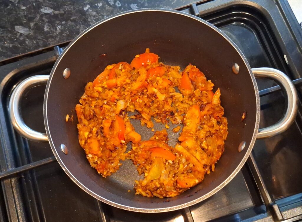 Tomatoes added to browned onions