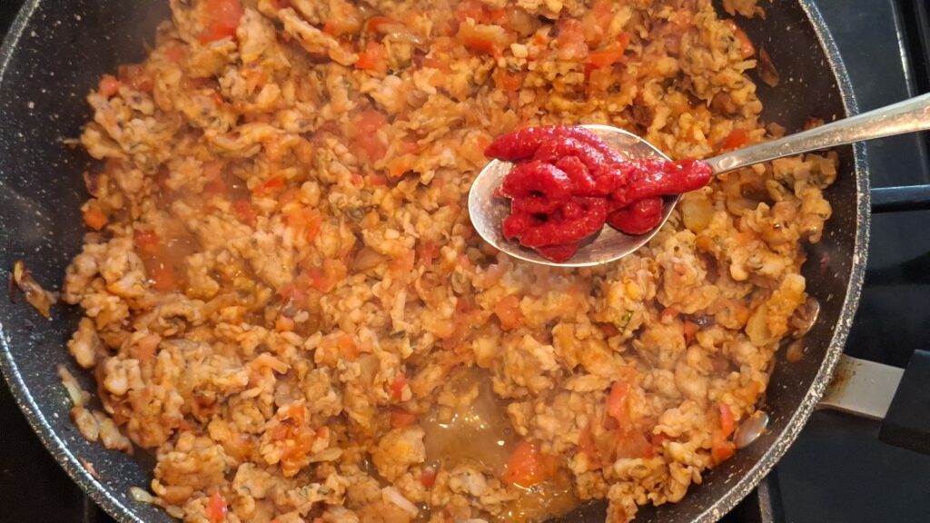 Tomatoes and tomato puree added to the mince meat