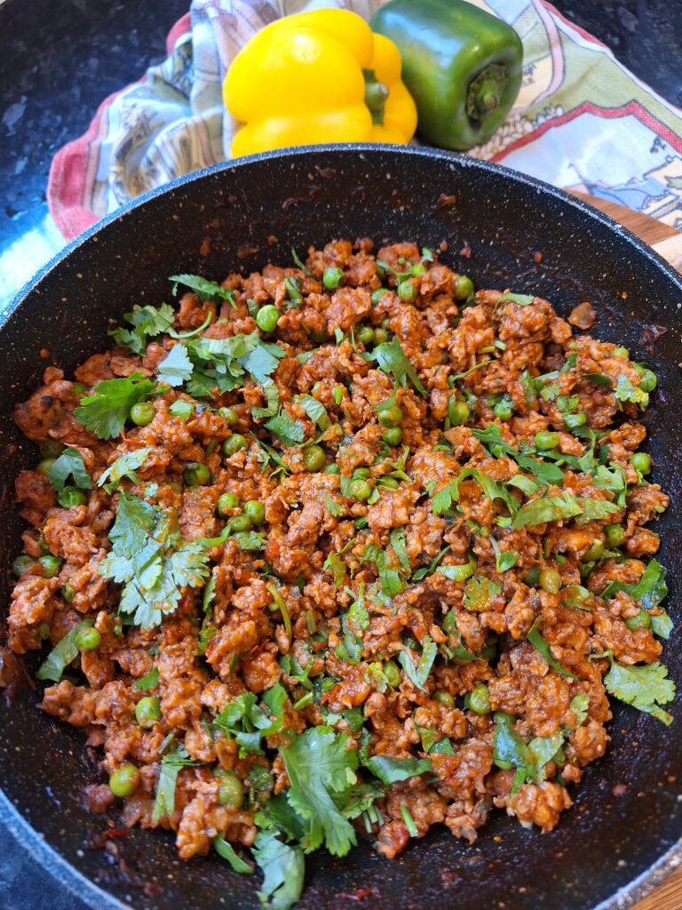 Freshly chopped coriander added to chicken keema