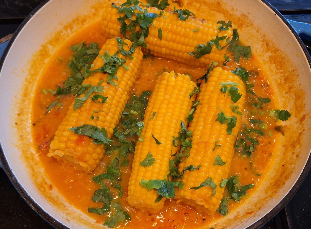 Add coriander to sweetcorn curry