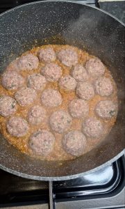Koftas placed into masala