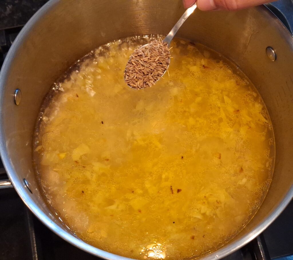 Add cumin seeds and salt