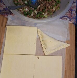 Pastry folded over and edges crimped