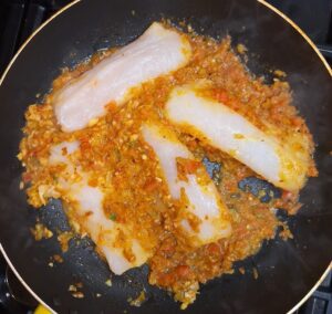 Add fish to the masala