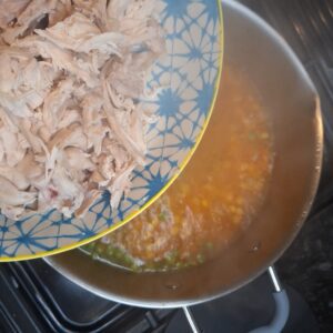 Add shredded chicken to the pan