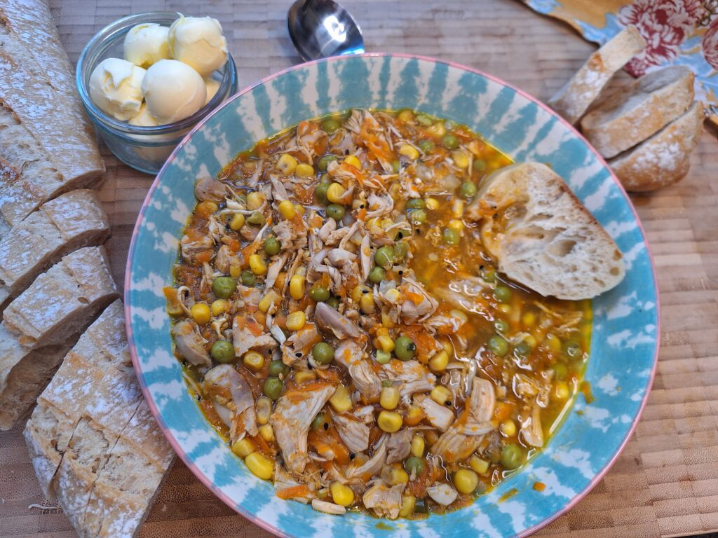 Chicken sweetcorn soup served with bread and butter