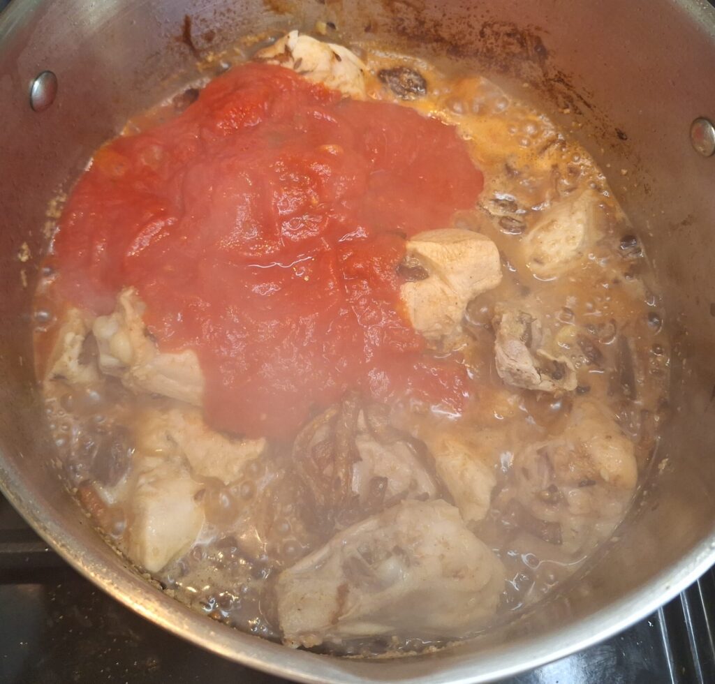 Browned chicken with tomatoes added