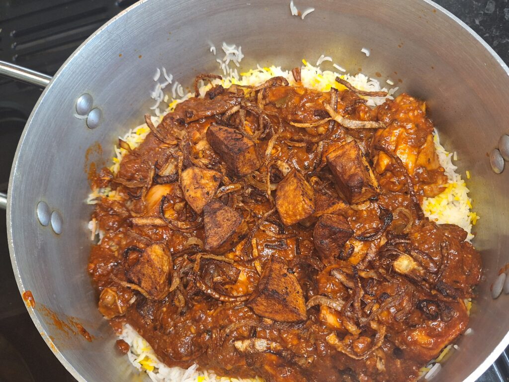Layering rice and meat