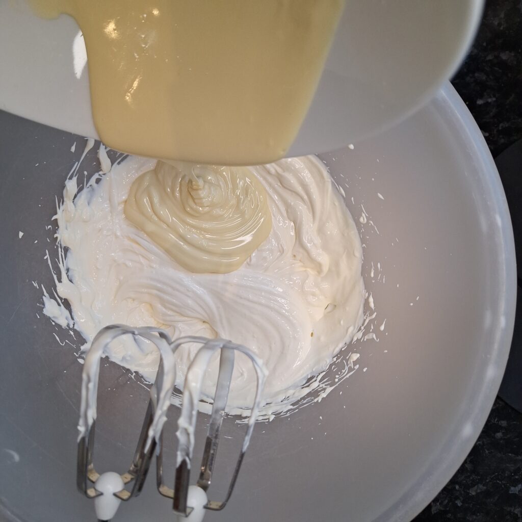 Softened cream cheese and melted white chocolate