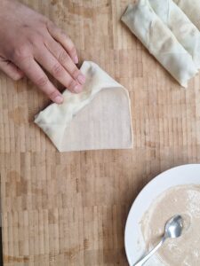 Folding corners of spring roll pastry