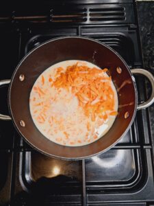 Add milk and cardamon to carrots