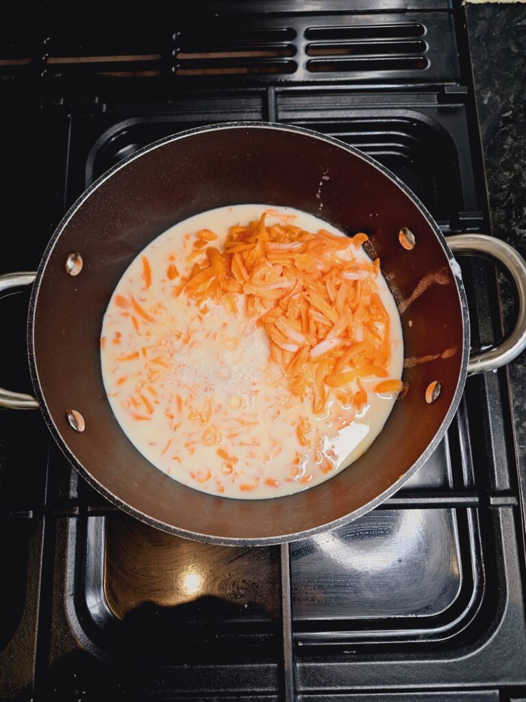 Add milk and cardamon to carrots