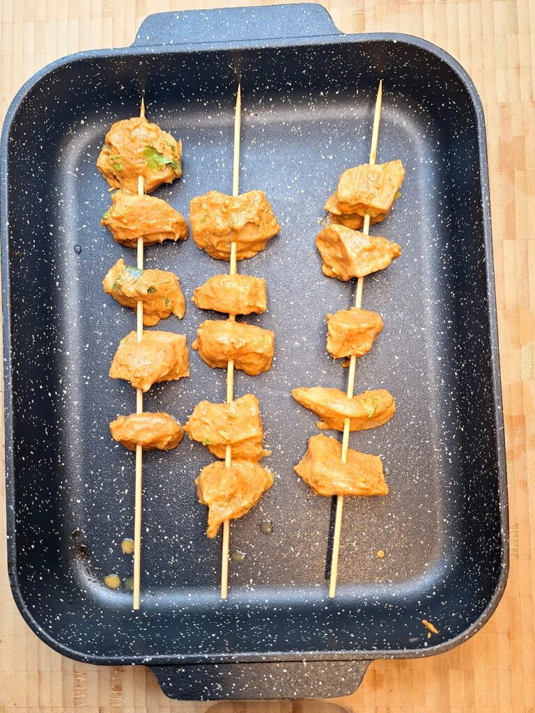 Put chicken on skewers