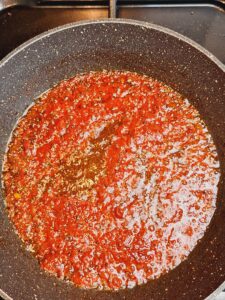 Simmer tomato spice paste