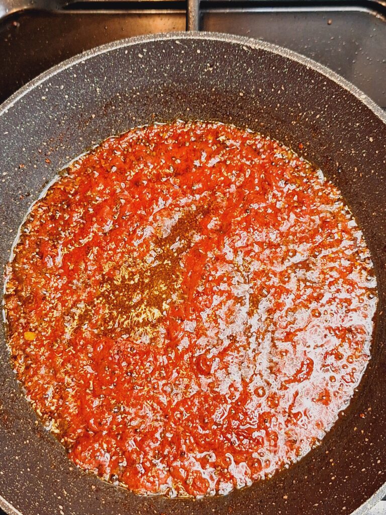Simmer tomato spice paste