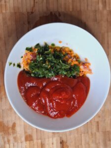 Add tomato ketchup to mixing bowl