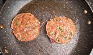 Burgers being fried