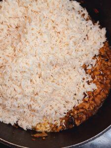 Add rice to the pan