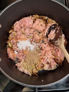 Add spices and the mince to the pan