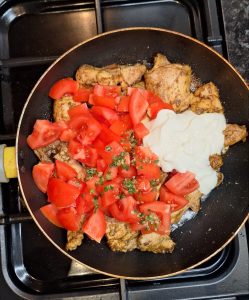 Add tomatoes, green chillies and yoghurt