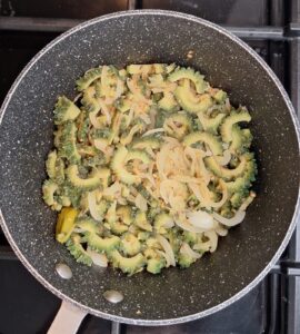 Cooking karela and onions