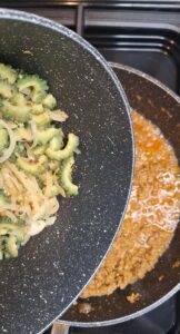 Adding karela to keema