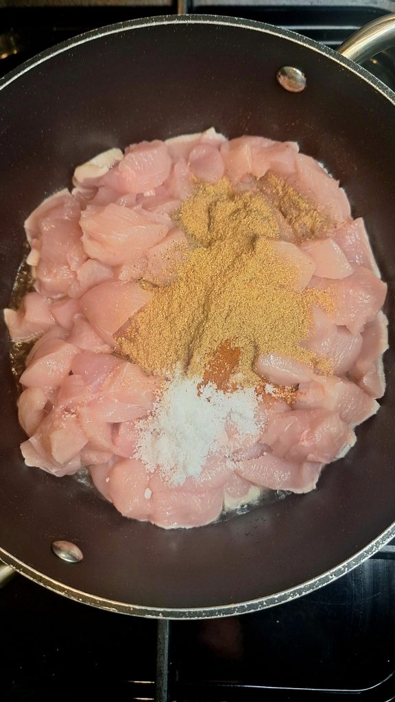 add chicken and spices