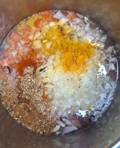 Add lamb, spices and onions