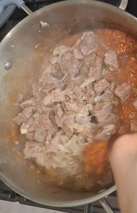 Add lamb to masala pan