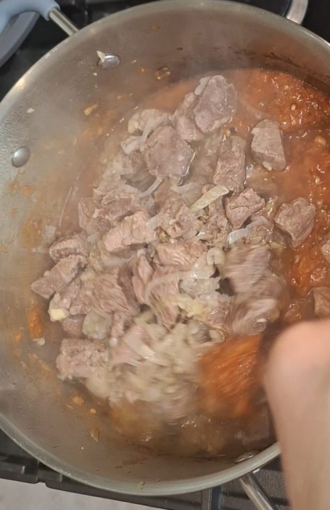 Add lamb to masala pan
