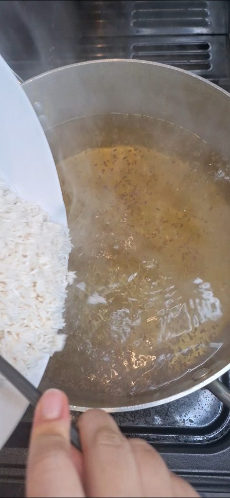 Add rice to pan and cook