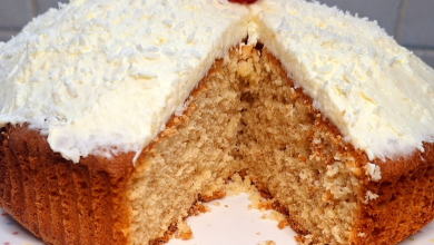 Moist coconut cake topped with shredded coconut