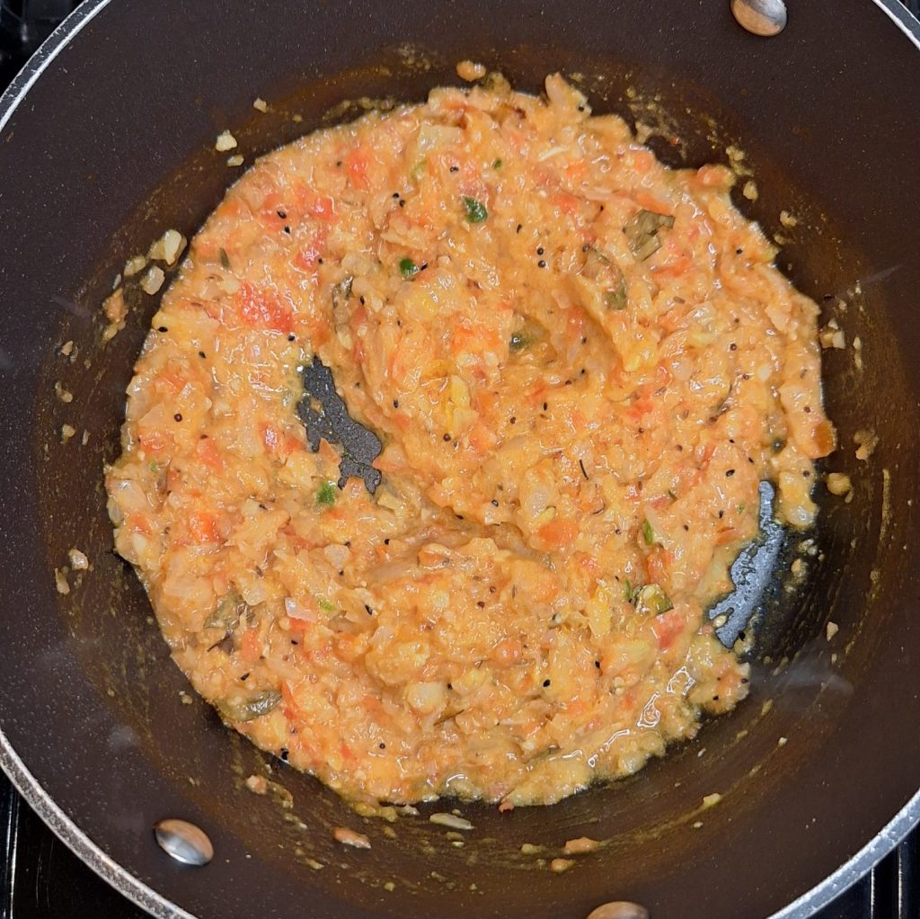 Stir through spices, tomatoes and onions