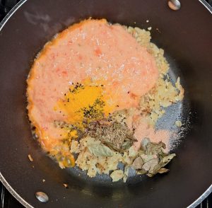 add tomatoes and spices for the easy vegetable curry