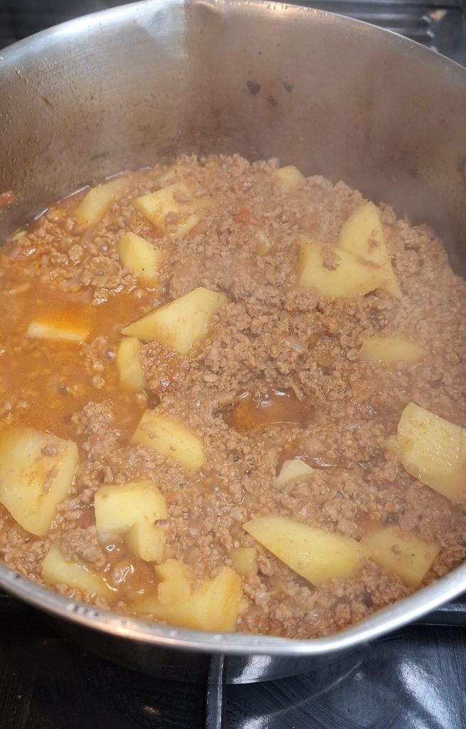 Cook potatoes in keema