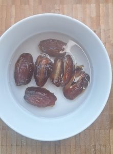 Soak dates in boiling water