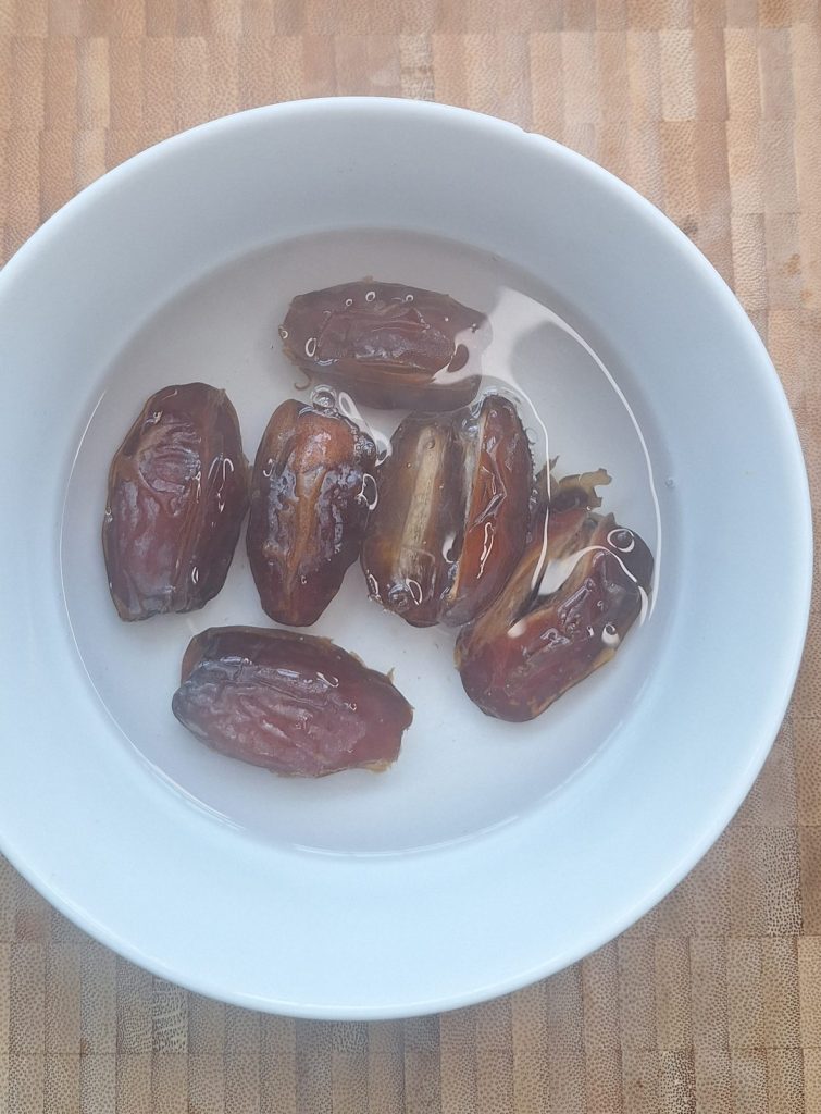 Soak dates in boiling water