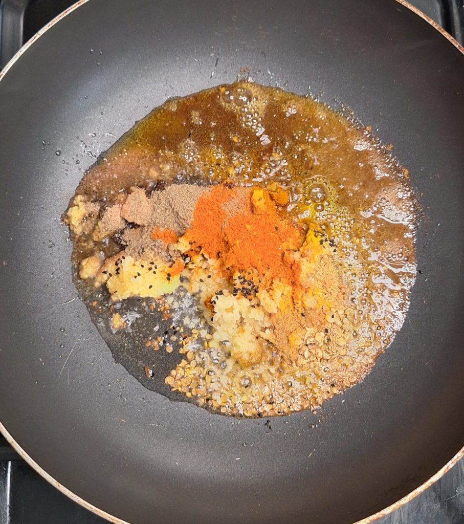 Add karahi spices to wok