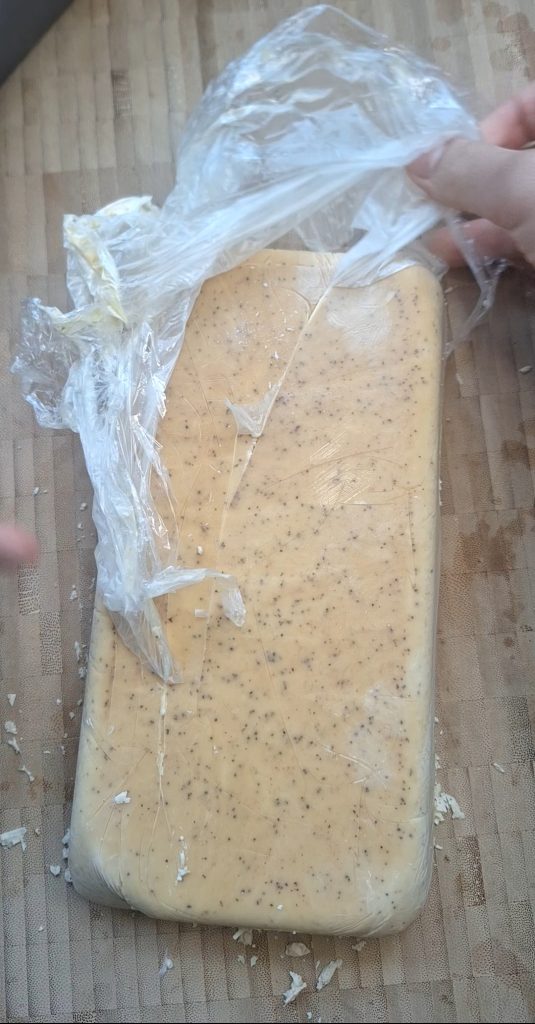 Remove cling film from ice cream