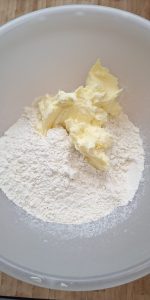 Add ghee mixture to flour mixture