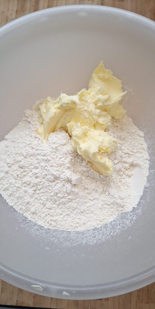 Add ghee mixture to flour mixture