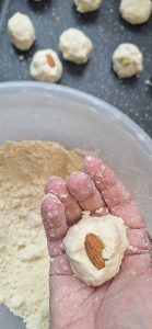 Add nuts to dough balls
