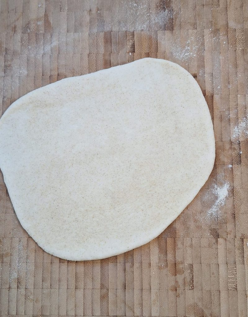 Roll out dough ball on floured surface