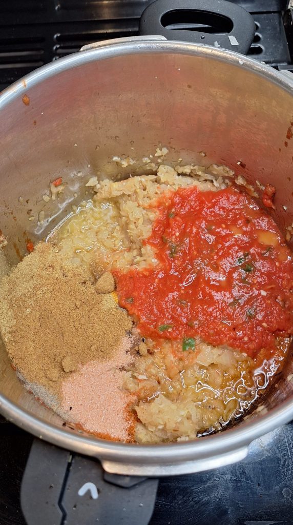 Add tomatoes and spices